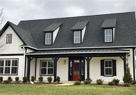 white metal roof on brick house|brick house with black shingles.